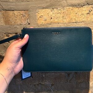 Blue DKNY wristlet pouch. NWT.
